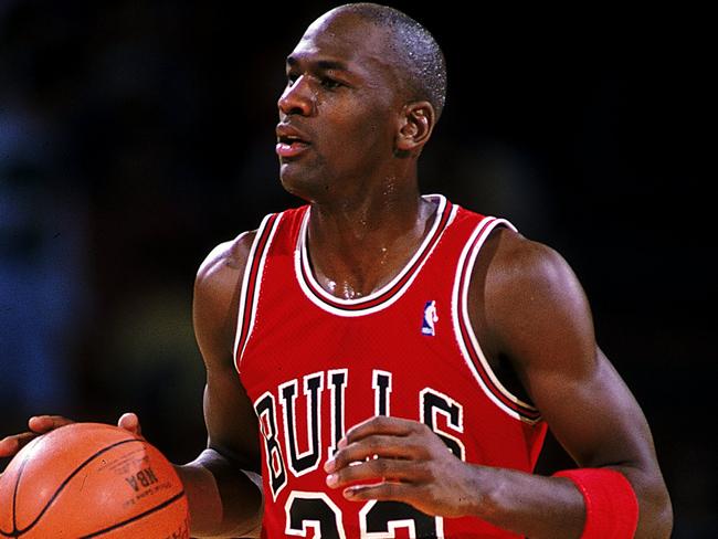 1990:  Michael Jordan #23 of the Chicago Bulls runs with the ball during the game.   Mandatory Credit: Tim DeFrisco  /Allsport