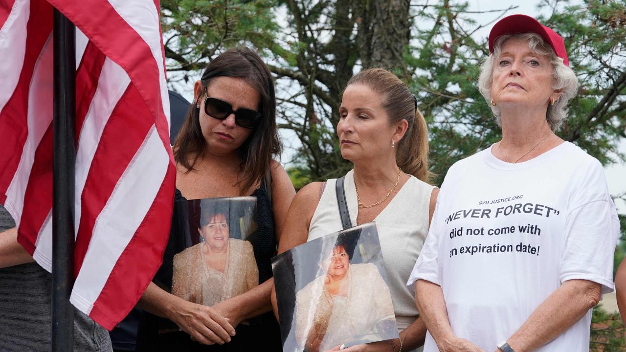 A group of 9/11 family members and survivors from the organisation 9/11 Justice hold a press conference in Bedminster, New Jersey, on July 29, 2022. - The group is protesting the Saudi Arabian-funded LIV Golf series which is being held at the nearby Trump National Golf Club Bedminster this weekend. (Photo by TIMOTHY A. CLARY / AFP)