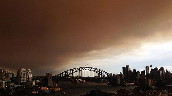 Harmful effect ... Sydney's CBD is shrouded in a haze of smoke from bushfires in Springwood, Winmalee and Lithgow in the Blue Mountains last October. Picture: Getty