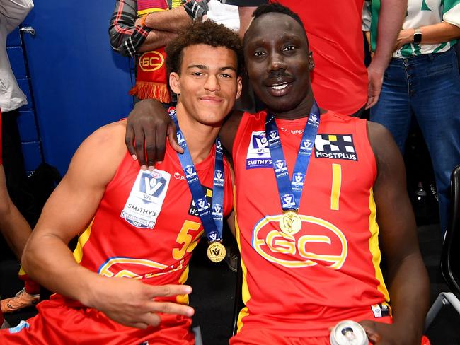 Leonardo Lombard and Mabior Chol of the Suns celebrate following the 2023 VFL premiership. Picture: Morgan Hancock/AFL Photos.