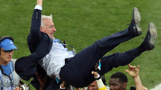 Didier Deschamps is hoisted aloft by France players after their World Cup final victory over Croatia.