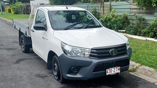 A white Toyota HiLux hire car found abandoned in Mooroobool on Sunday with the vehicle's tyres slashed.