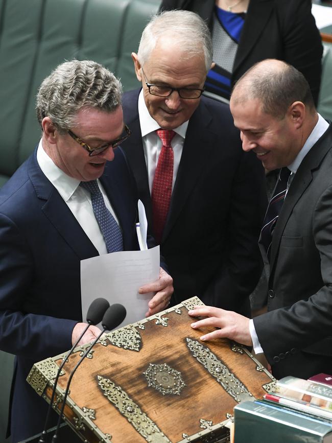 Christopher Pyne, Malcolm Turnbull and Josh Frydenberg take a look inside the dispatch box in the House of Representatives at Parliament House in Canberra ahead of the May 2018 Budget. Picture: AAP