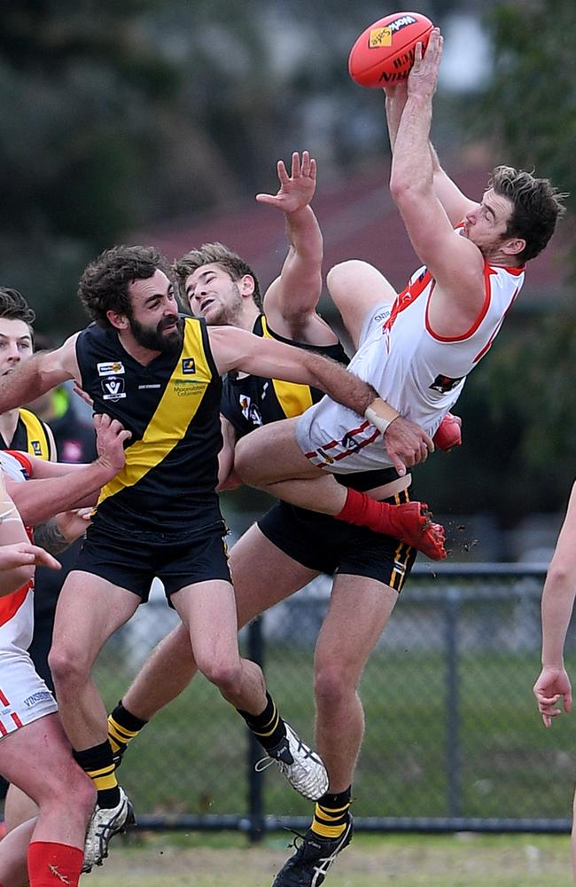 Sorrento coach Luke Tapscott hauls in a huge grab against Seaford. Picture: Andy Brownbill