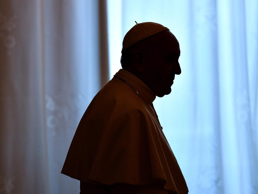 (FILES) In this file photo taken on June 22, 2018 Pope Francis is silhouetted during a private audience at the Vatican. - Pope Francis will meet leaders of the US Catholic Church on Thursday, September 11, 2018, the Vatican announced, after a high profile accusation that the pontiff covered up sexual abuse allegations against an American cardinal. Cardinal Daniel DiNardo, the president of the US Conference of Catholic Bishops, will attend the meeting after saying last month he was eager to meet the pope following the scandal. Two other conference officials will be at the meeting, as will Cardinal Sean O'Malley, the head of the Pontifical Commission for the Protection of Minors, Vatican spokesman Greg Burke said on Tuesday. (Photo by Alberto PIZZOLI / AFP)