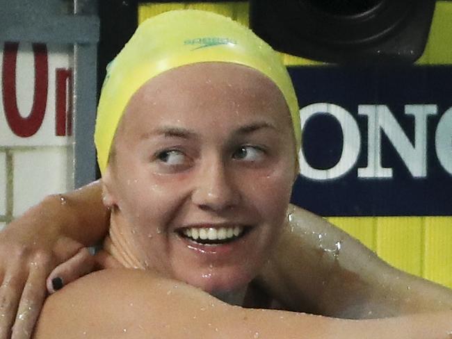 Australian Ariarne Titmus, left, celebrates after winning gold at the Women's 800m freestyle finals at the Aquatic Centre during the 2018 Commonwealth Games on the Gold Coast, Australia, Monday, April 9, 2018. (AP Photo/Rick Rycroft)