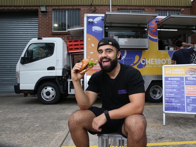 14/03/2024. Ali Chebbani in front of his TikTok-famous burger foodtruck in Roselands in Sydney's Western suburbs. Mr Chebbani, who worked at McDonald's as a teenager, started selling burgers from his Bankstown driveaway in 2020 during lockdown. His business went viral on the platform allowing him to turn it into a foodtruck and, soon, a new Marrickville restaurant. Britta Campion / The Australian