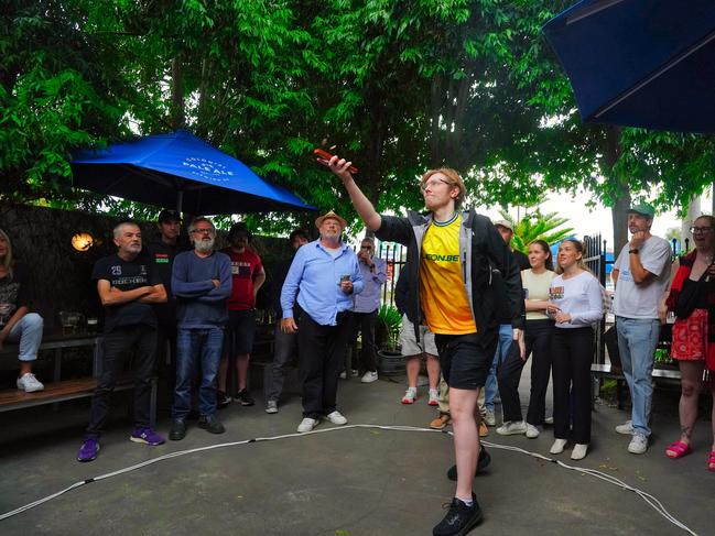 A lively game of two-up is underway at The Palace Hotel in Melbourne. Picture: NewsWire / Luis Enrique Ascui