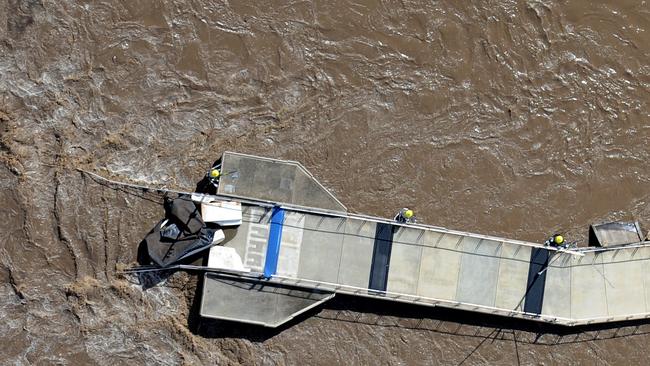 A section of the Riverwalk remained after breaking up on the Brisbane river on Thursday, January 13, 2011. The Brisbane river reached 4.46 metres, almost a metre lower than the historic flood of 1974 but still inundating dozens of suburbs.