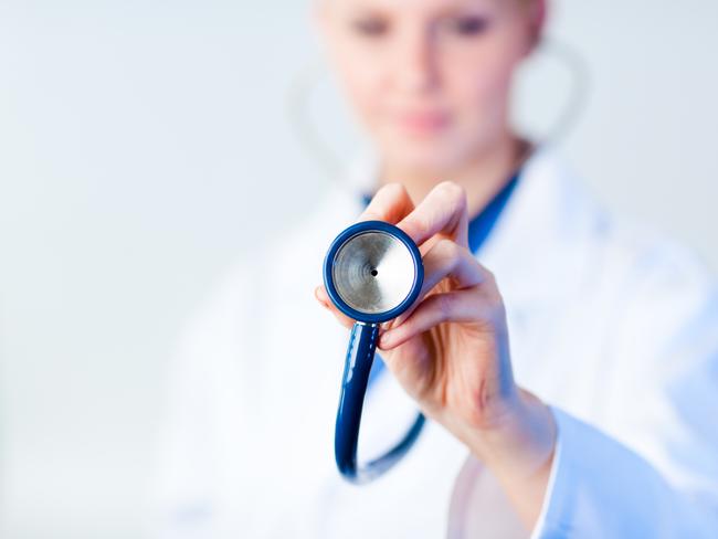 Doctor holding out stethescope with focus on object