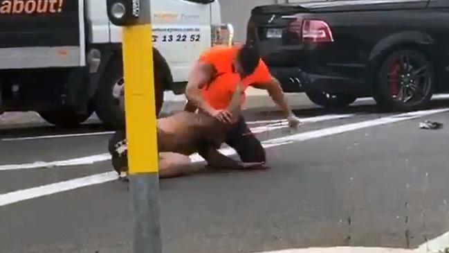 The man continues to punch the man on the ground. Picture: Twitter