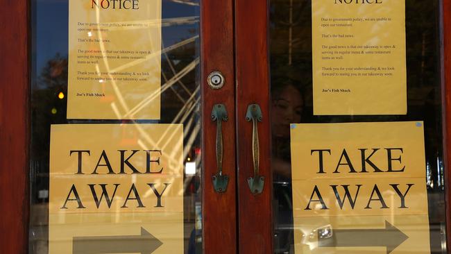 Door signage at Joe's Fish Shack in Fremantle advising “Due to government policy, we are unable to open our restaurant”. Picture: Paul Kane/Getty Images