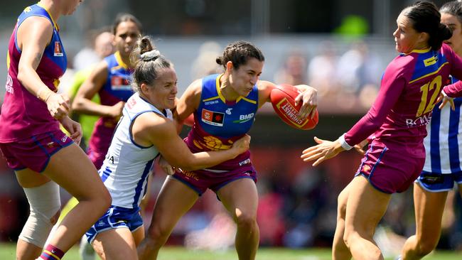 MELBOURNE, AUSTRALIA - DECEMBER 03: Ally Anderson of the Lions is tackled by Emma Kearney of the Kangaroos during the AFLW Grand Final match between North Melbourne Tasmania Kangaroos and Brisbane Lions at Ikon Park, on December 03, 2023, in Melbourne, Australia. (Photo by Josh Chadwick/AFL Photos/via Getty Images)