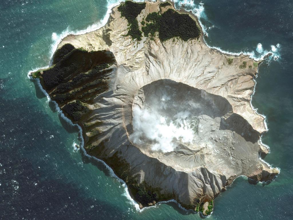 Some tourists were on the edge of the crater 30 minutes before the eruption. Picture: Maxar Technologies via AP.