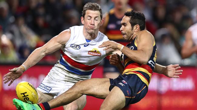 Dale Morris can’t stop Eddie Betts from getting a kick away. Picture: Getty Images