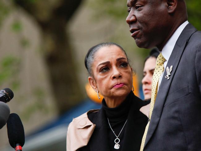 Kathryn Townsend Griffin, daughter of singer-songwriter Ed Townsend looks on as lawyer Benjamin Crump speaks to the media. Picture: AFP