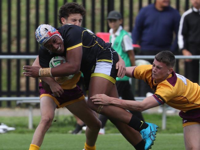 Daily telegraph May 16/5/23. NRL Schoolboys Bass High ( black top) vs Holy Cross Ryde ( maroon and yellow cloths) play at Cabramatta.picture John Grainger