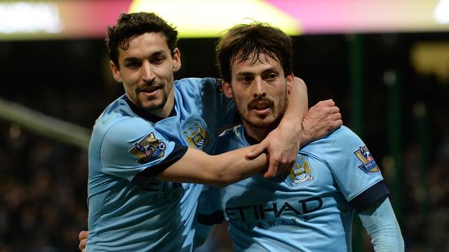 David Silva (R) celebrates scoring the opening goal with Jesus Navas.