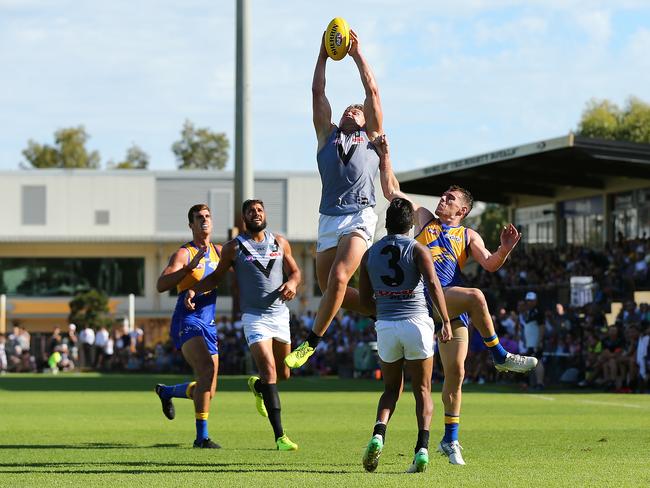 PERTH, AUSTRALIA - FEBRUARY 25: Ollie Wines of the Power marks the ball during the JLT Community Series AFL match between the West Coast Eagles and the Port Adelaide Power at Leederville Oval on February 25, 2018 in Perth, Australia.  (Photo by Paul Kane/Getty Images)