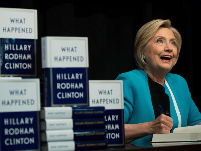 Hillary Clinton signs copies of her new book What Happened in New York City. Picture: Drew Angerer/Getty Images/AFP