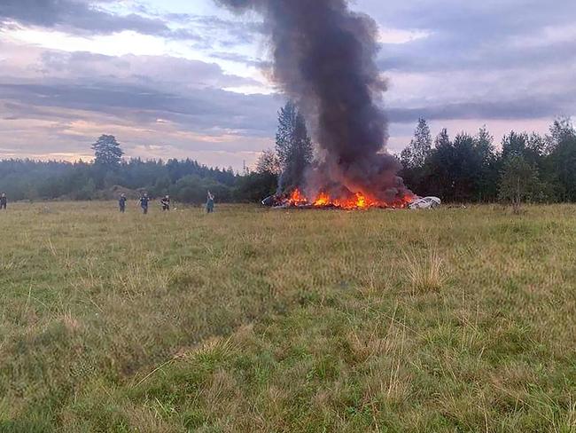 This photograph posted on a Wagner linked Telegram channel @grey_zone shows wreckage of the burning plane carrying Prigozhin. Picture: Handout / TELEGRAM/ @grey_zone / AFP