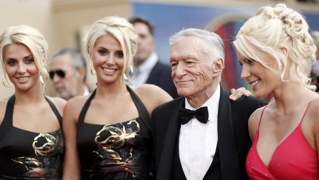 Identical twins Karissa and Kristina Shannon, Hugh Hefner and Crystal Harris, right, arrive at the taping of the American Film Institute Life Achievement Awards honoring actor Michael Douglas. (AP Photo/Matt Sayles)