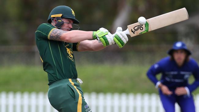 Premier: Jonty Rushton swings hard for Northcote. Picture: Stuart Milligan