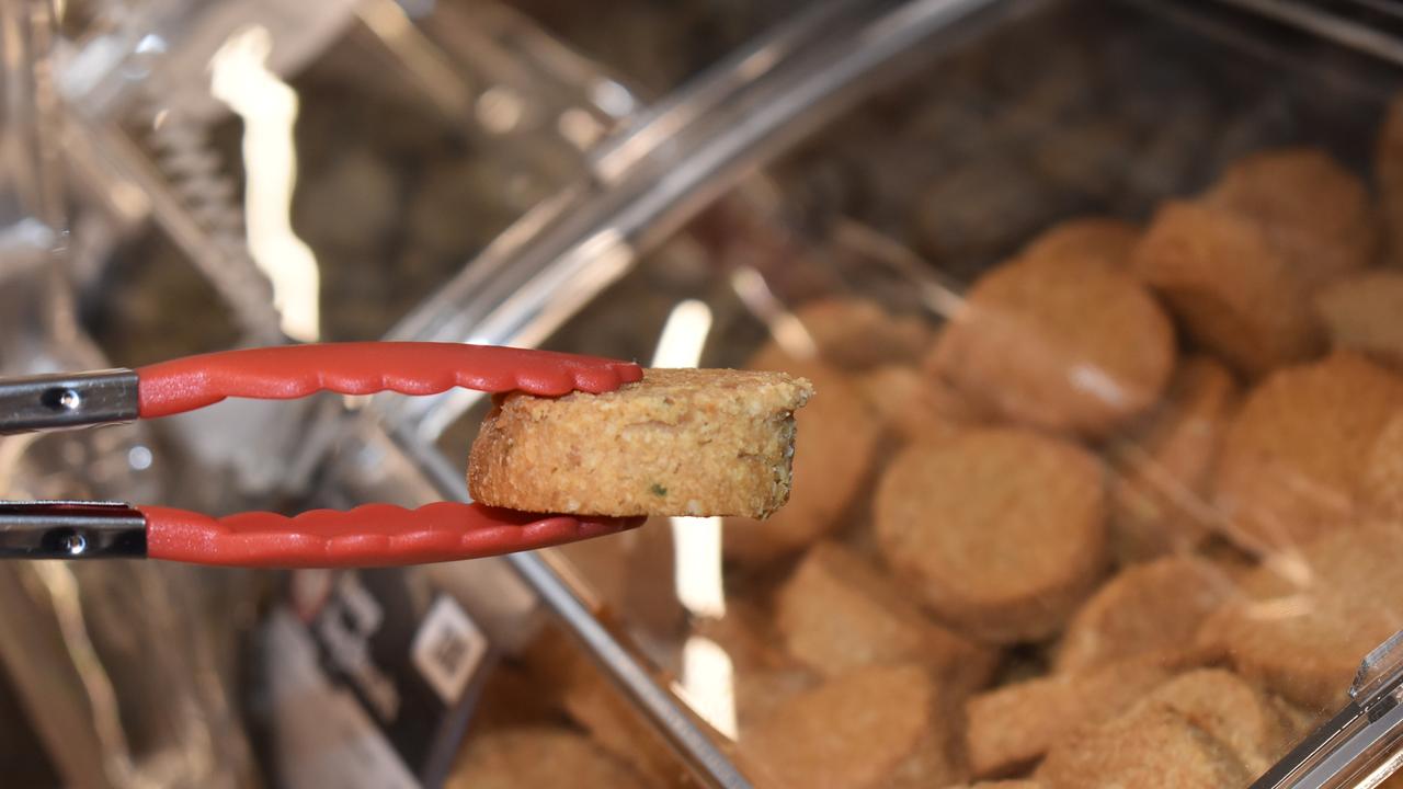 A dog-friendly ‘peanut butter’ cookie at the pet pick-and-mix bar in Andergrove Coles. Picture: Lillian Watkins