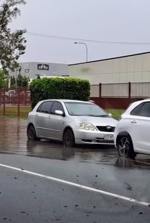 Ute driving through flood waters on the Gold Coast