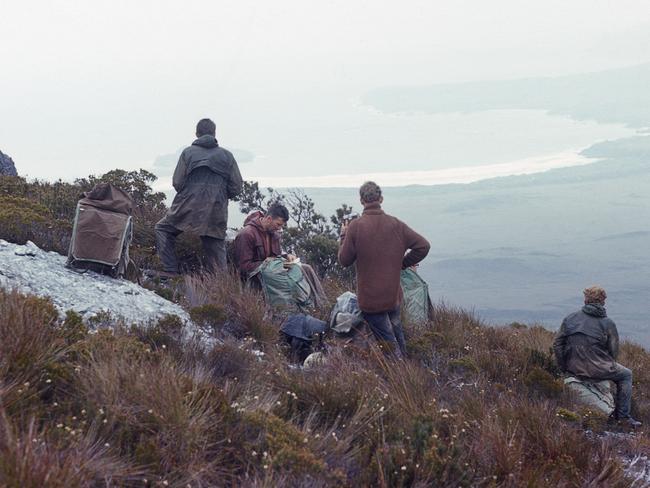 Bruce Cole, second from left, leading the Hobart Walking Club party to Precipitous Bluff in 1964. Picture: RICHARD BENNETT.