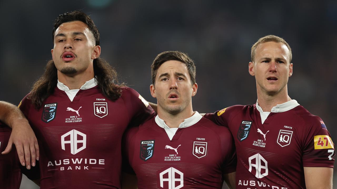 SYDNEY, AUSTRALIA – JULY 12: Tino Fa'asuamaleaui, Ben Hunt and Daly Cherry-Evans of the Maroons stand and sing the national anthem during game three of the State of Origin series between New South Wales Blues and Queensland Maroons at Accor Stadium on July 12, 2023 in Sydney, Australia. (Photo by Mark Kolbe/Getty Images)