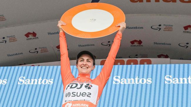 Australian cyclist Grace Brown from French team FDJ-SUEZ celebrates on the podium after winning the Women's Tour Down Under. Photo by Brenton EDWARDS / AFP