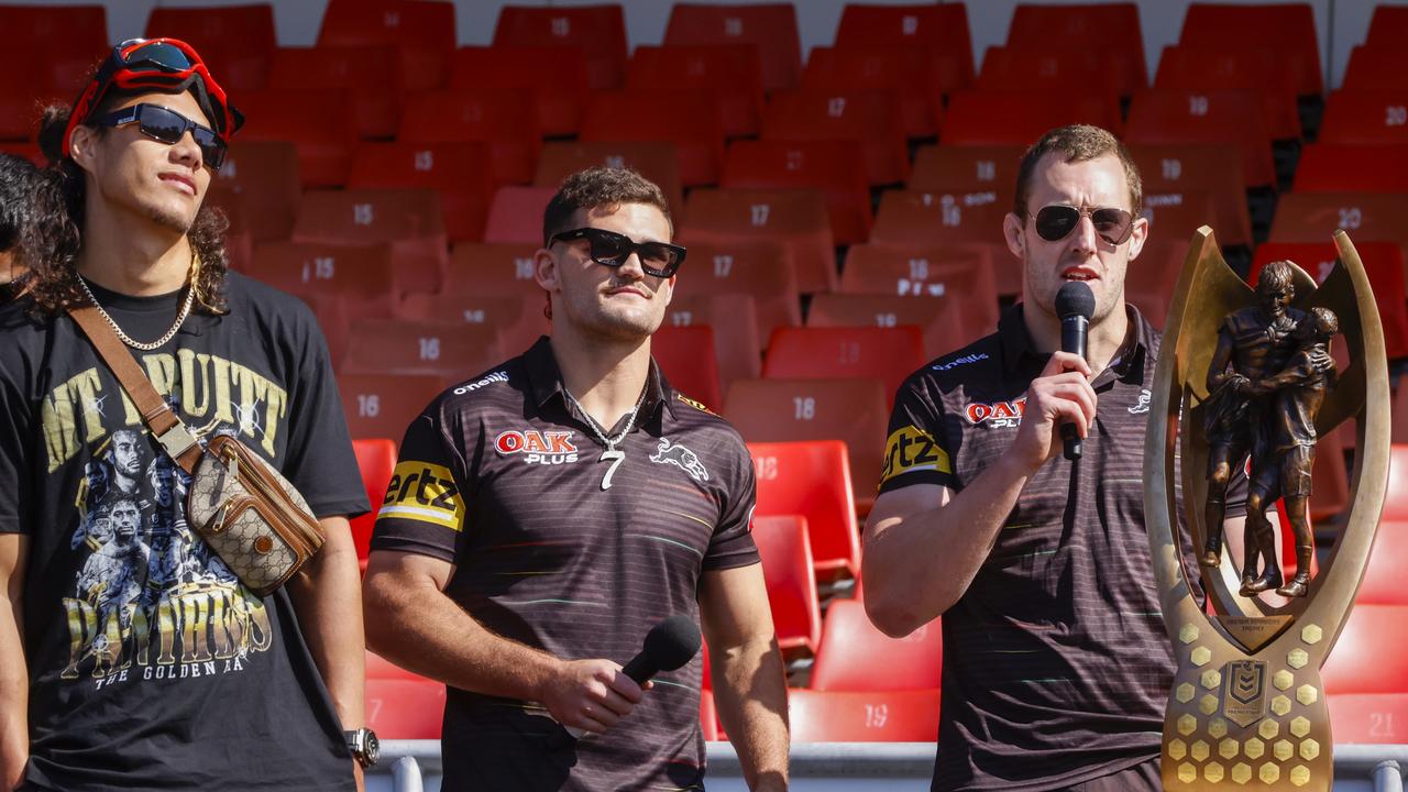 Jarome Luai, Nathan Cleary and Isaah Yeo at BlueBet Stadium after winning the grand final. Picture: Jenny Evans/Getty Images