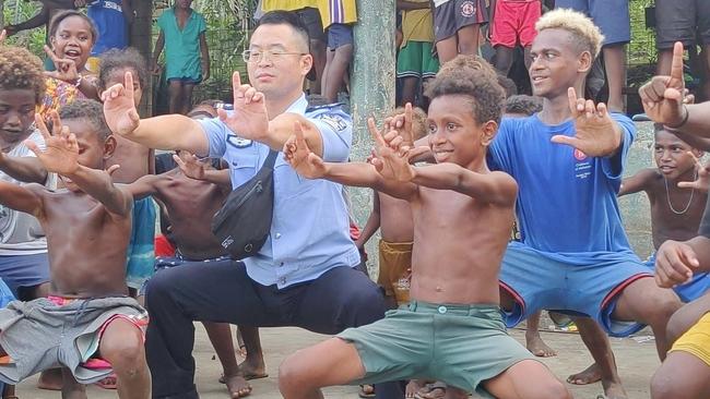 Chinese police demonstrate martial arts to children in the Solomon Islands. Picture: Facebook/Chinese Embassy in Solomon Islands