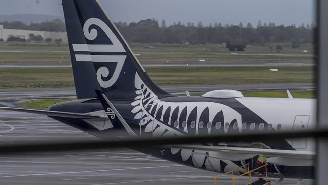 ADELAIDE, AUSTRALIA - NewsWire Photos JULY 16 2021: Adelaide Airport. Passengers are seen checking in with Air NewZealand plane. Picture: NCA NewsWire / Roy VanDerVegt