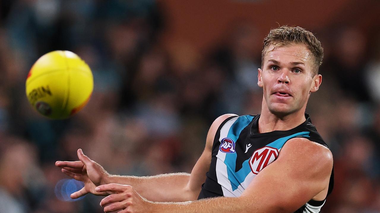 ADELAIDE, AUSTRALIA – APRIL 13: Dan Houston of the Power kicks the ball during the 2024 AFL Round 05 match between the Port Adelaide Power and the Fremantle Dockers at Adelaide Oval on April 13, 2024 in Adelaide, Australia. (Photo by James Elsby/AFL Photos via Getty Images)