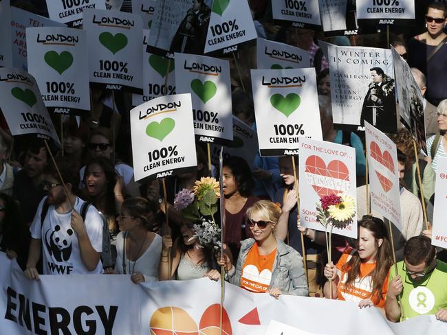 Global protest ... Demonstrators display placards and banners as they participate in the Peoples Climate March in London. Picture: Adrian Dennis/AFP