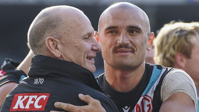 Powell-Pepper and coach Ken Hinkley. (Photo by Mark Brake/Getty Images)