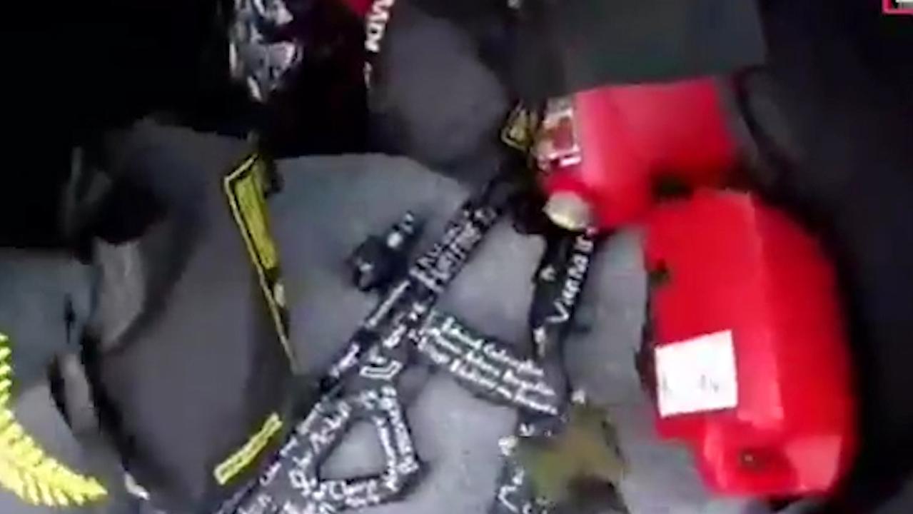 In this frame from video that was live-streamed yesterday, Brenton Tarrant is seen reaching for these guns in the back of his car before the mosque shootings in Christchurch, New Zealand.