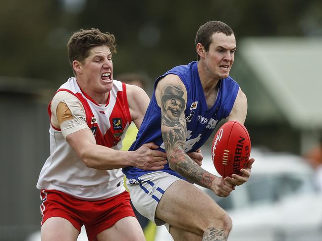 M MPNFL Division 2 football: Karingal v Hastings. Jordan Pomeroy - Karingal and Wade Delahaye - Hastings. Picture:  Valeriu Campan