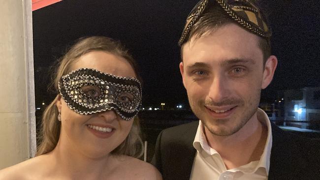 Lucy and Rhys Lovett celebrate at the Gympie RSL Masked Ball, April 29 2023.