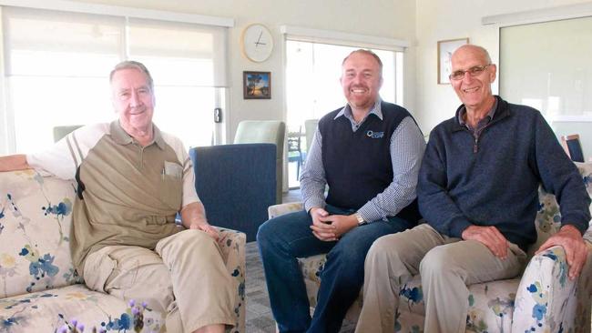 HAPPY HERE: Regency Park residents Graeme Parkinson, left, and Dudley Fitzgerald, right, enjoy the afternoon with manager Chris Newley, centre. Picture: Marian Faa