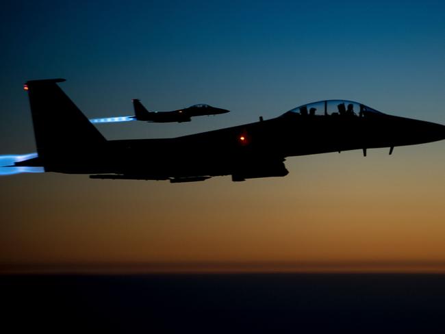 (FILES) This file photo taken by the US Air Forces Central Command and released by the Defense Video & Imagery Distribution System (DVIDS)  shows a pair of US Air Force F-15E Strike Eagles flying over northern Iraq early in the morning of September 23, 2014 after conducting airstrikes in Syria.   A US warplane shot down an Iran-made drone operated by pro-regime forces in southern Syria early on June 20, 2017, officials said, the second such incident in less than two weeks. The US-led coalition said in a statement that an F-15E Strike Eagle jet destroyed the Shaheed-129 drone around 12:30 am (2130 GMT) northeast of the Al-Tanaf garrison, which is close to the Jordanian border. / AFP PHOTO / US Air Forces Central Command / Senior Airman Matthew Bruch