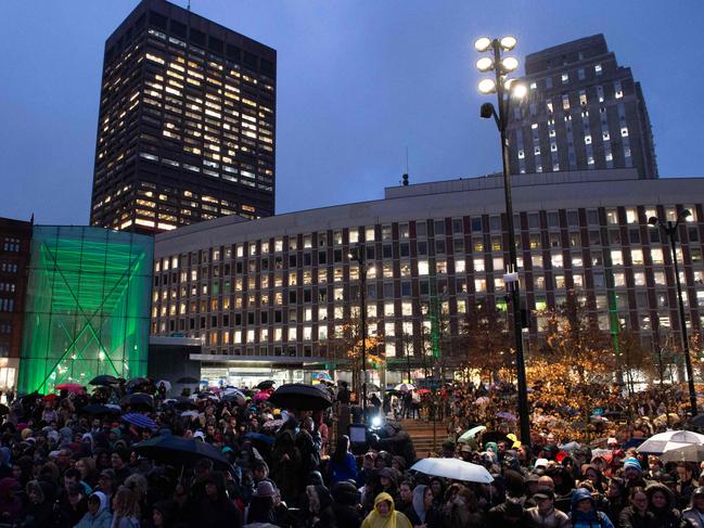 Crowds gathered under the rain at City Hall Plaza. Picture: AFP.