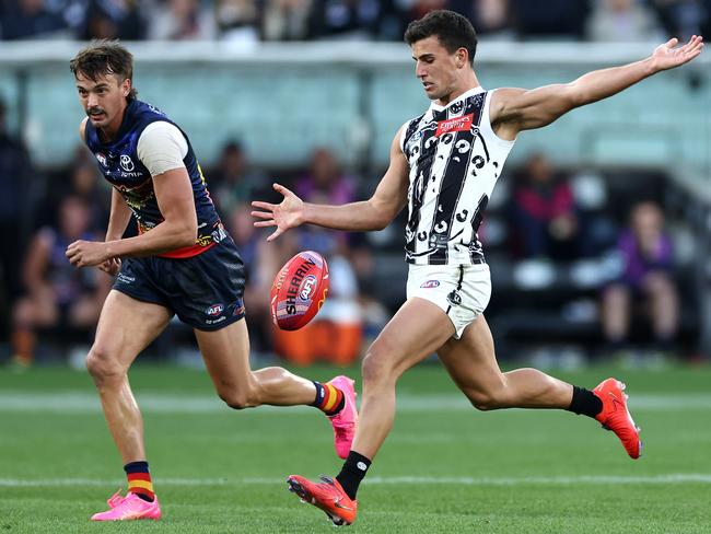 MELBOURNE, AUSTRALIA - MAY 18: Nick Daicos of the Magpies kicks during the round 10 AFL match between Collingwood Magpies and Kuwarna (the Adelaide Crows) at Melbourne Cricket Ground, on May 18, 2024, in Melbourne, Australia. (Photo by Quinn Rooney/Getty Images)