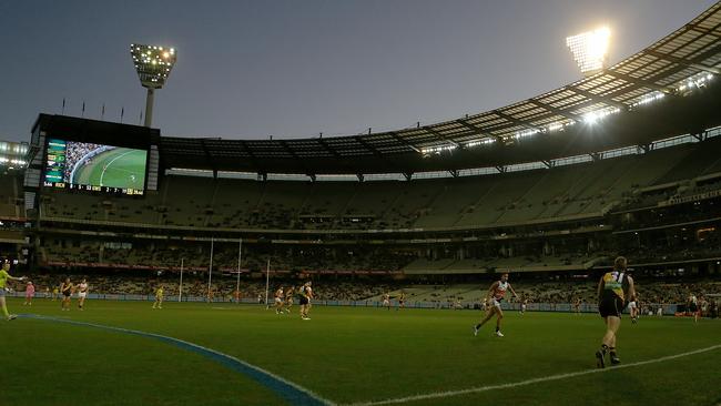 The lights go on during a game between Richmond and GWS at the MCG. Picture: Tim Carrafa. 