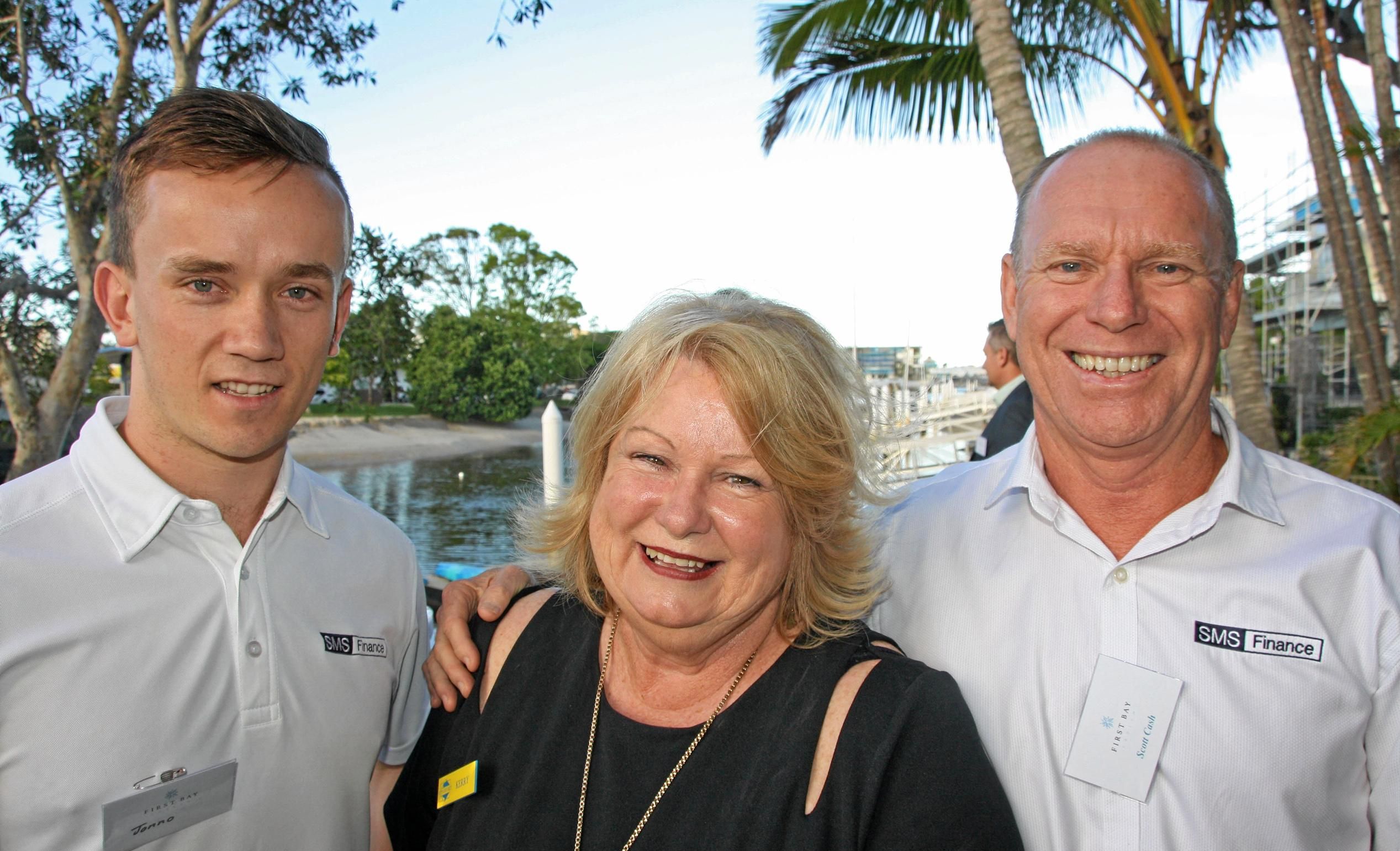 Jonno Scaroni and Scott Cash of SMS Finance with of Kerry Glover of North Shore Real Estate at Mooloolaba to celebrate the launch of the luxury First Bay Coolum development. Picture: Erle Levey