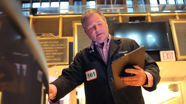 Traders work the floor of the New York Stock Exchange.