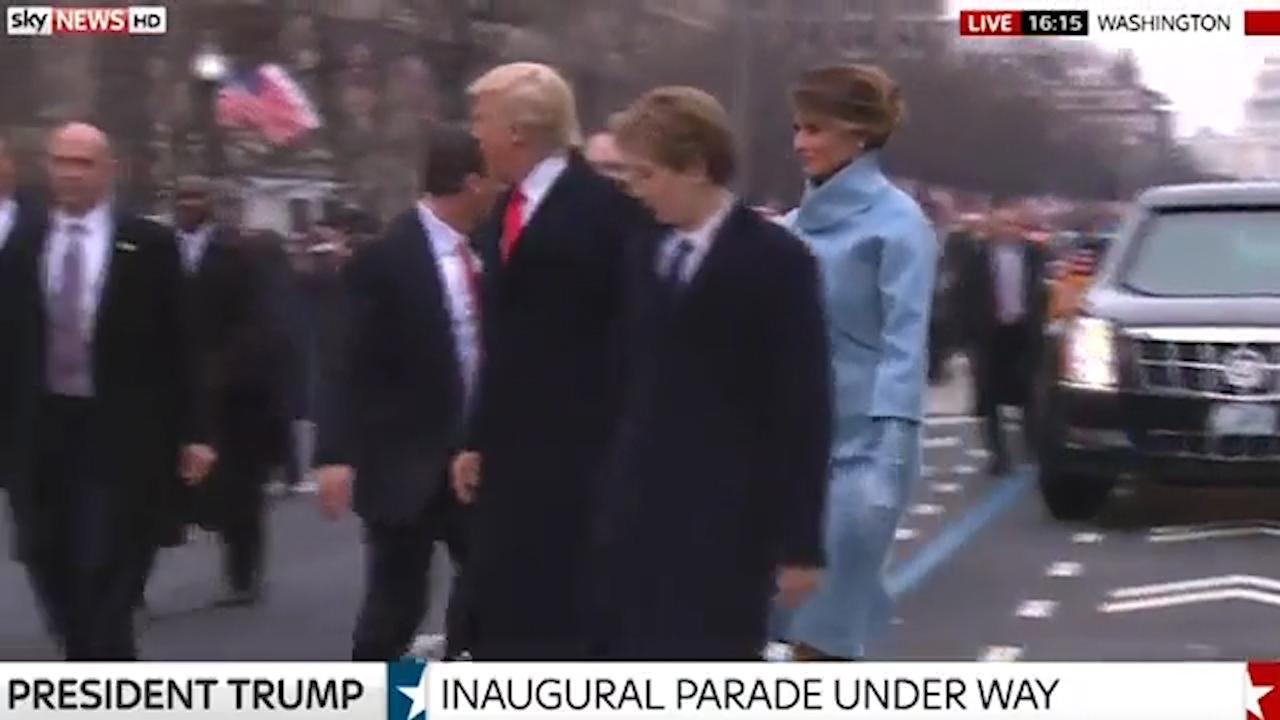 Barron Trump pulls hand away from Melania during inauguration parade