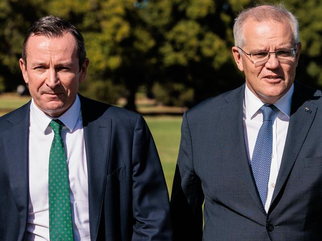 WA Premier Mark McGowan (left) and Prime Minister Scott Morrison are seen arriving for a press conference in Perth, Thursday, March 17, 2022.  (AAP Image/Richard Wainwright) NO ARCHIVING